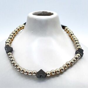Gold beads with black hearts bracelet.
